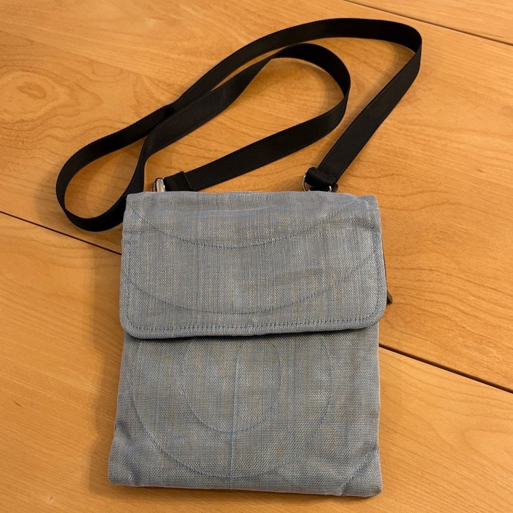 Smateria Light Blue Mesh Hip/Crossbody Bag with Black Adjustable Strap.